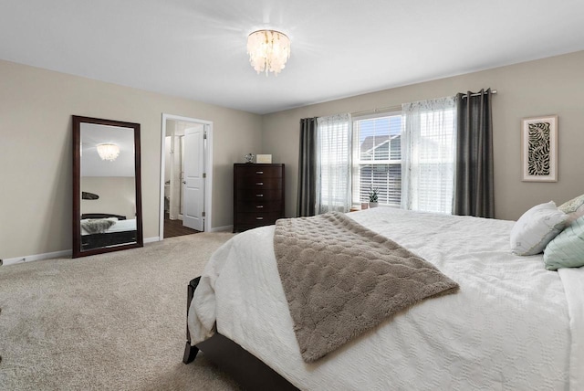 1677 Liatris Dr, Sun Prairie, WI 53590 - bedroom with carpet flooring, baseboards, and a chandelier