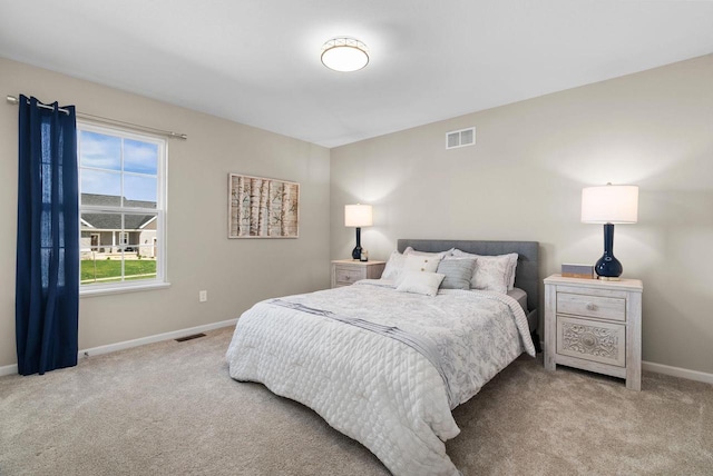 1677 Liatris Dr, Sun Prairie, WI 53590 - bedroom with baseboards, visible vents, and carpet