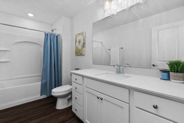 1677 Liatris Dr, Sun Prairie, WI 53590 - full bathroom featuring visible vents, shower / bath combo, wood finished floors, vanity, and toilet