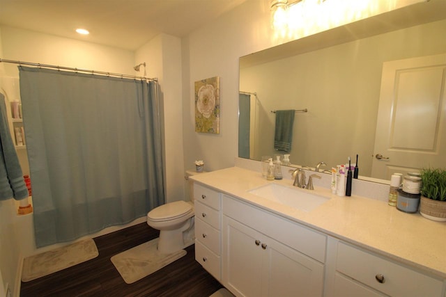 1677 Liatris Dr, Sun Prairie, WI 53590 - bathroom featuring shower / bath combination with curtain, wood finished floors, vanity, toilet, and recessed lighting