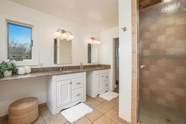 bathroom featuring vanity, tile patterned floors, and a stall shower