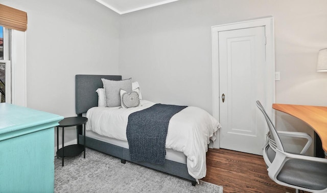 bedroom featuring wood finished floors