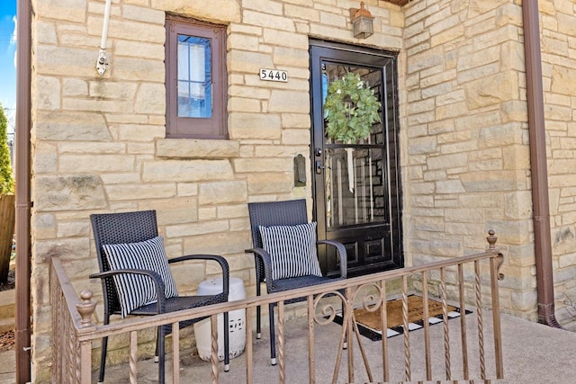 entrance to property with stone siding