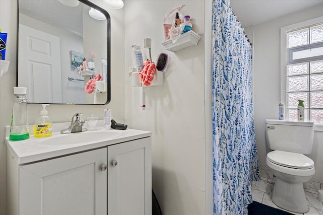 full bathroom with a shower with curtain, vanity, marble finish floor, and toilet