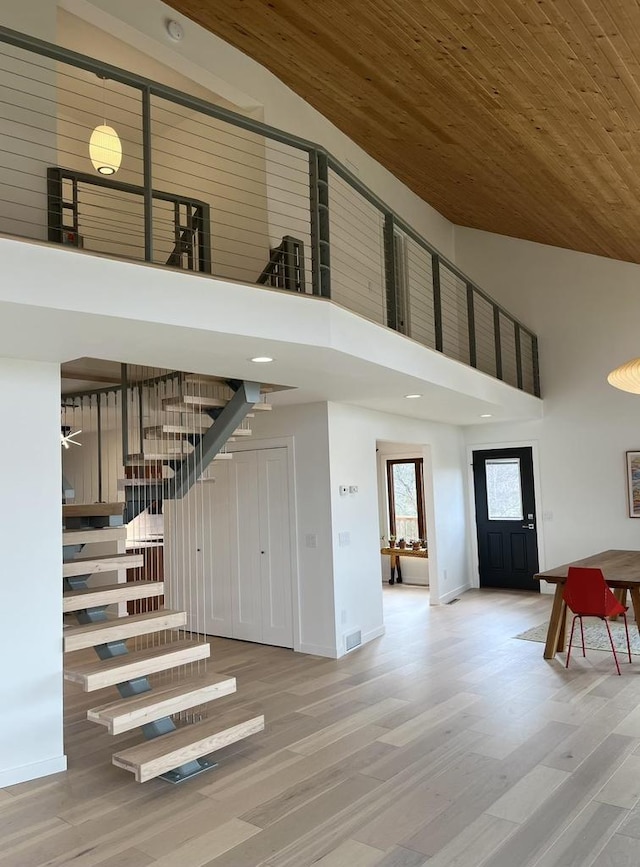 8226 Scott Rd, Cross Plains, WI 53528 - interior space featuring stairs, a towering ceiling, wood finished floors, baseboards, and wood ceiling