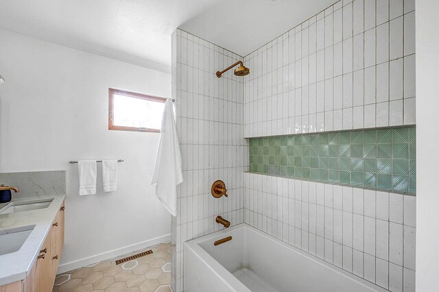 8226 Scott Rd, Cross Plains, WI 53528 - bathroom featuring visible vents, a sink, tile patterned floors, and double vanity