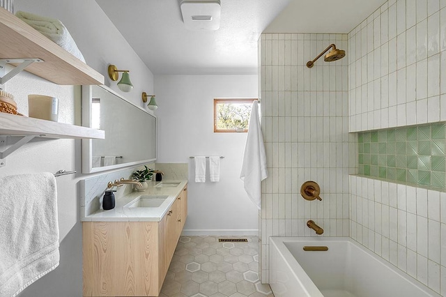 8226 Scott Rd, Cross Plains, WI 53528 - full bath with visible vents, tile patterned flooring, baseboards, vanity, and washtub / shower combination
