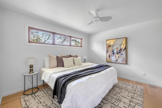 8226 Scott Rd, Cross Plains, WI 53528 - bedroom with a ceiling fan, baseboards, and light wood finished floors