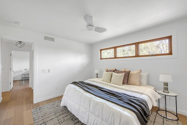 8226 Scott Rd, Cross Plains, WI 53528 - bedroom with baseboards, ceiling fan, light wood-type flooring, and visible vents