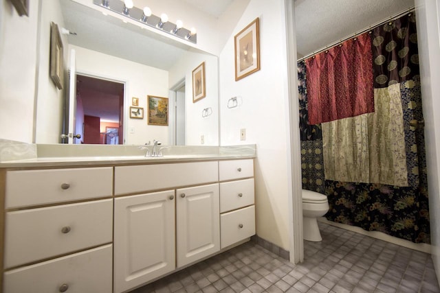 bathroom with baseboards, vanity, a shower with shower curtain, and toilet