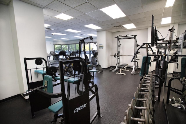 workout area with visible vents and a drop ceiling