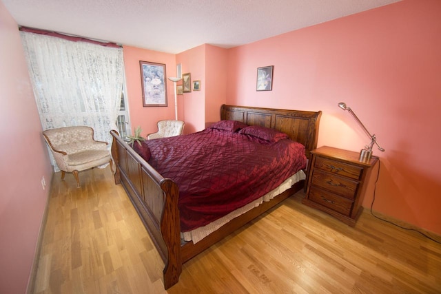 bedroom with light wood-style floors