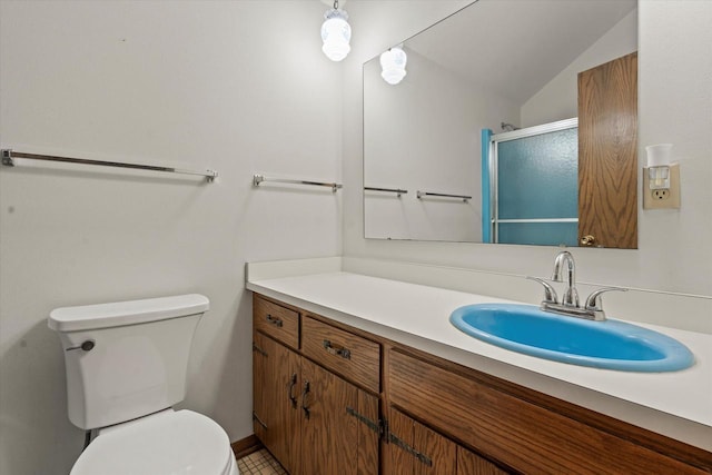 618 W Main St, Waterford, WI 53185 - bathroom featuring toilet, vanity, an enclosed shower, and lofted ceiling