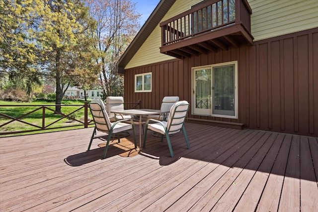 618 W Main St, Waterford, WI 53185 - wooden deck with outdoor dining space and a lawn