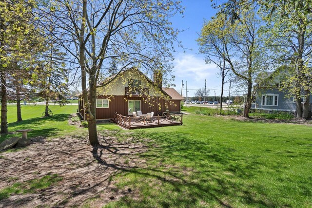 618 W Main St, Waterford, WI 53185 - view of grassy yard with a wooden deck