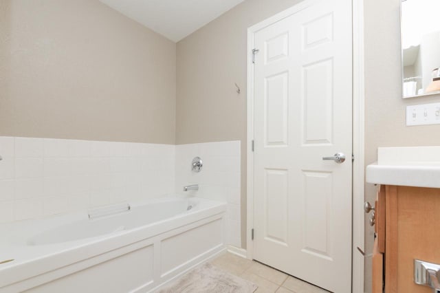 full bathroom with tile patterned floors, vanity, and a bath