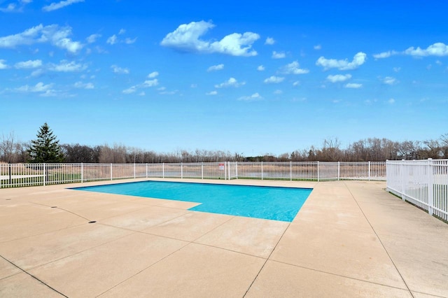 view of swimming pool featuring fence, a patio area, and a fenced in pool