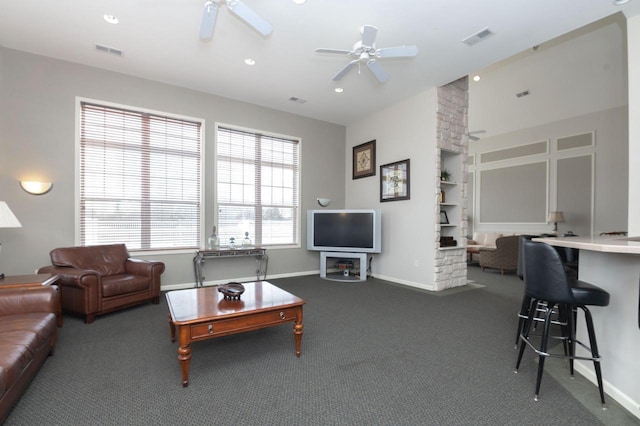 living area featuring visible vents, ceiling fan, and carpet floors