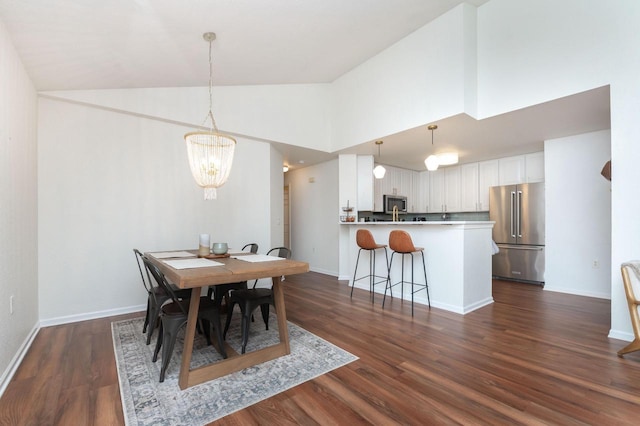 dining space with a notable chandelier, baseboards, high vaulted ceiling, and dark wood-type flooring
