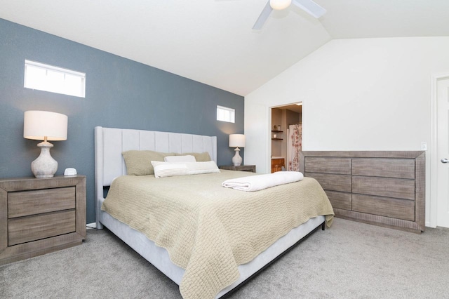 carpeted bedroom featuring connected bathroom, a ceiling fan, multiple windows, and lofted ceiling