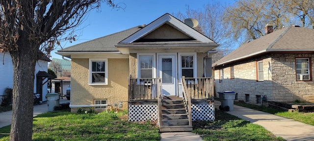 4226 W Sieben Pl, Milwaukee, WI 53216 - bungalow-style home featuring roof with shingles, stucco siding, and stone siding
