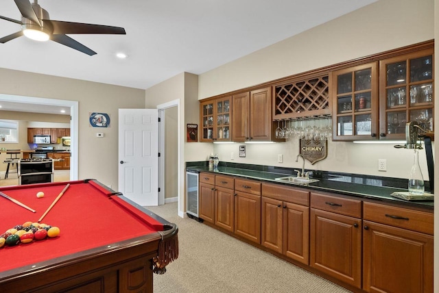 2575 Back Rd, Burlington, WI 53105 - rec room featuring a sink, beverage cooler, ceiling fan, light colored carpet, and wet bar
