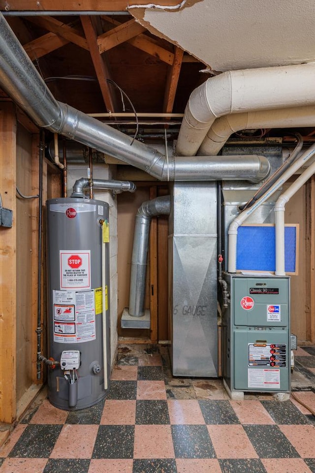 utility room featuring gas water heater