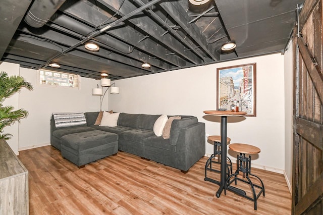 living room featuring wood finished floors and baseboards