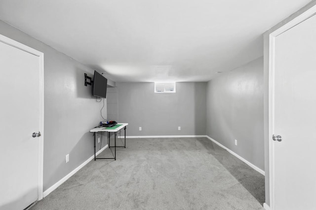 basement featuring carpet and baseboards
