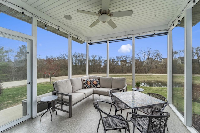 402 Burnt Sienna Dr, Middleton, WI 53562 - sunroom / solarium featuring a healthy amount of sunlight, ceiling fan, a water view, and an outdoor living space