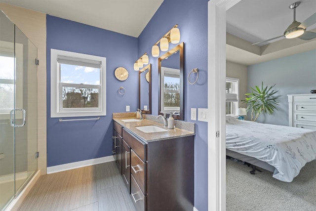 402 Burnt Sienna Dr, Middleton, WI 53562 - ensuite bathroom with a shower stall, a sink, double vanity, ensuite bathroom, and baseboards