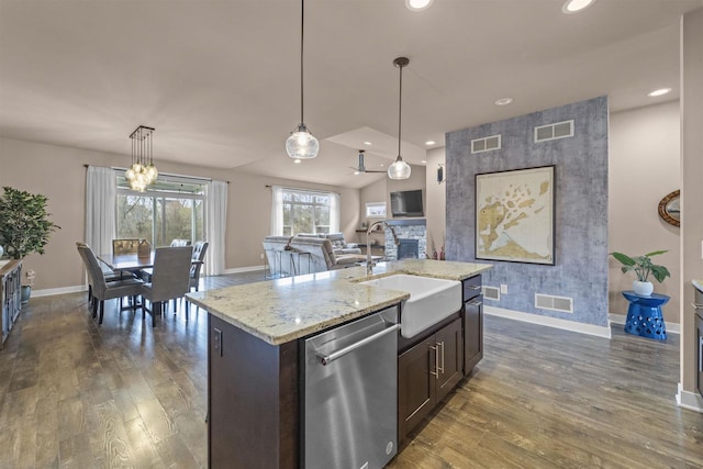 402 Burnt Sienna Dr, Middleton, WI 53562 - kitchen featuring stainless steel dishwasher, a sink, visible vents, and baseboards