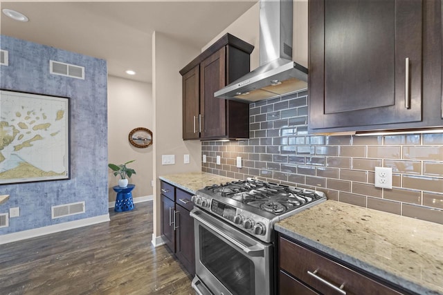 402 Burnt Sienna Dr, Middleton, WI 53562 - kitchen featuring visible vents, dark brown cabinets, baseboards, stainless steel gas range, and wall chimney exhaust hood