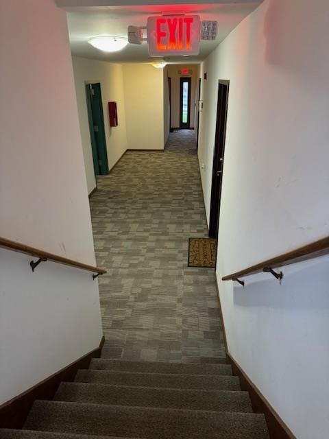 stairway featuring baseboards
