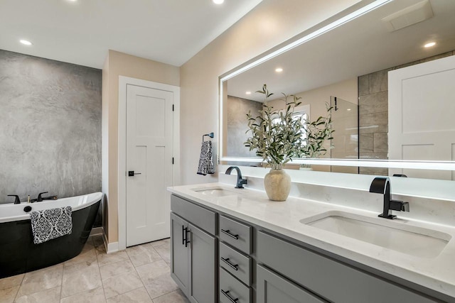 2352 Ryan Ave, Plymouth, WI 53073 - full bath featuring marble finish floor, a sink, a freestanding bath, and double vanity
