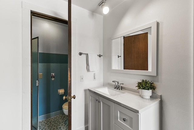 bathroom with vanity and toilet