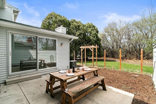 view of patio / terrace featuring central AC unit, outdoor dining area, and a pergola