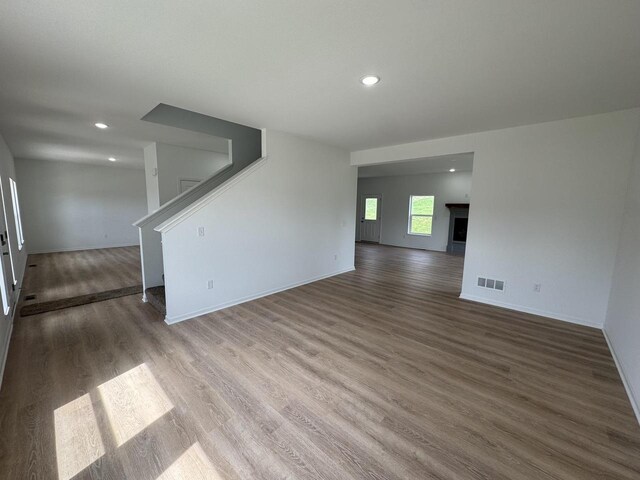 306 Filardo Ct, Mineral Point, WI 53565 - empty room featuring recessed lighting, stairs, visible vents, and wood finished floors