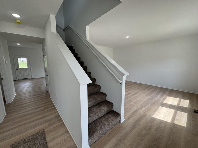 306 Filardo Ct, Mineral Point, WI 53565 - stairs featuring recessed lighting, wood finished floors, and baseboards