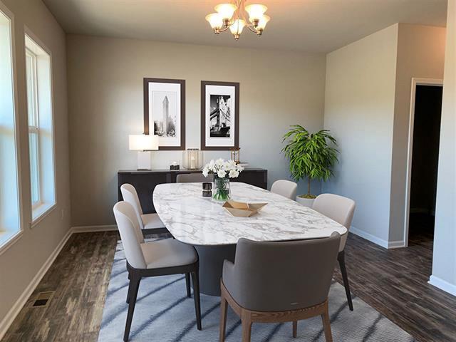 306 Filardo Ct, Mineral Point, WI 53565 - dining space with visible vents, a notable chandelier, dark wood finished floors, and baseboards