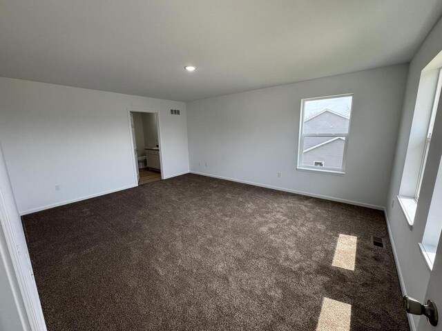 306 Filardo Ct, Mineral Point, WI 53565 - unfurnished room with baseboards, visible vents, dark colored carpet, and recessed lighting