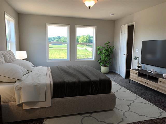 306 Filardo Ct, Mineral Point, WI 53565 - carpeted bedroom featuring baseboards and multiple windows