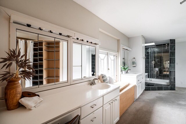 full bathroom with a stall shower, a garden tub, and vanity