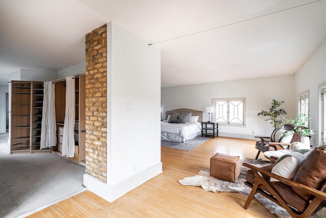 bedroom featuring wood finished floors and baseboards
