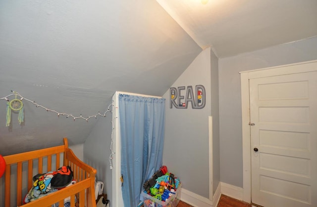 1922 45th St, Kenosha, WI 53140 - bedroom featuring baseboards, wood finished floors, and lofted ceiling