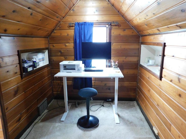 carpeted home office featuring wood walls, visible vents, vaulted ceiling, and wooden ceiling