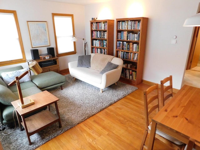interior space with wood finished floors and baseboards