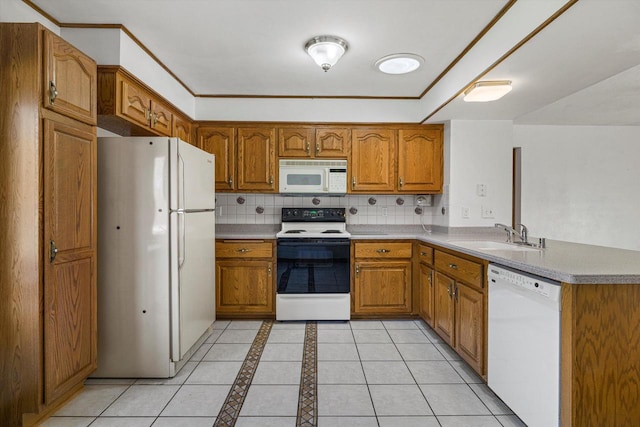 2500 S Brookside Pkwy, New Berlin, WI 53151 - kitchen with a peninsula, a sink, brown cabinets, and white appliances