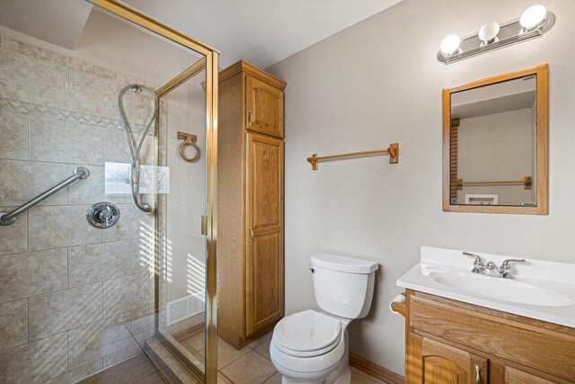 2500 S Brookside Pkwy, New Berlin, WI 53151 - full bathroom with a stall shower, toilet, tile patterned flooring, and vanity