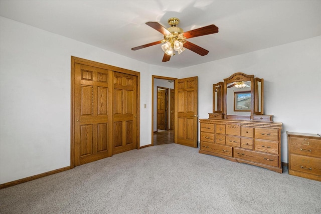 2500 S Brookside Pkwy, New Berlin, WI 53151 - bedroom with ceiling fan, a closet, baseboards, and light carpet